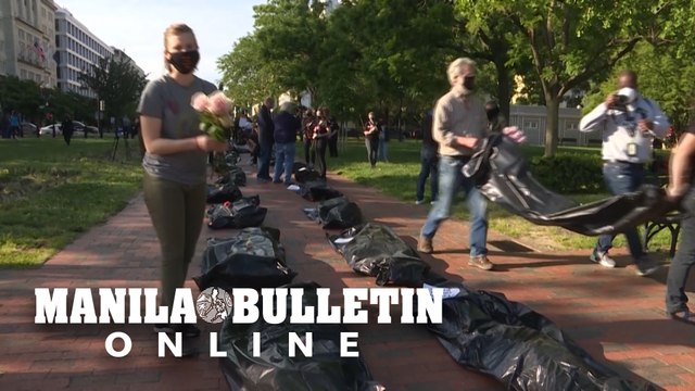 Protesters stage mock funeral procession with 'body bags' outside White House
