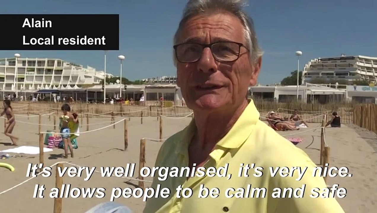 French beachgoers try out social distancing ropes
