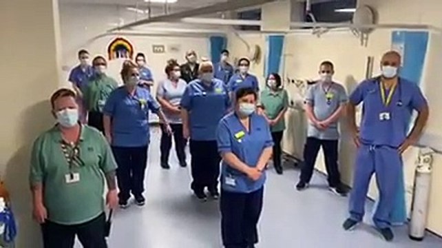 NHS workers clap for the public
