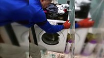 Çamaşır makinesinin altındaki gizli bölmede 7 bin paket kaçak sigara ele geçirildi