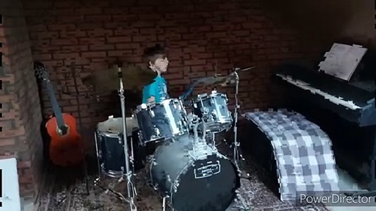 Nikita plays the drums
