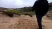 Grip lift and hold of a natural stone with the left hand and while walking around