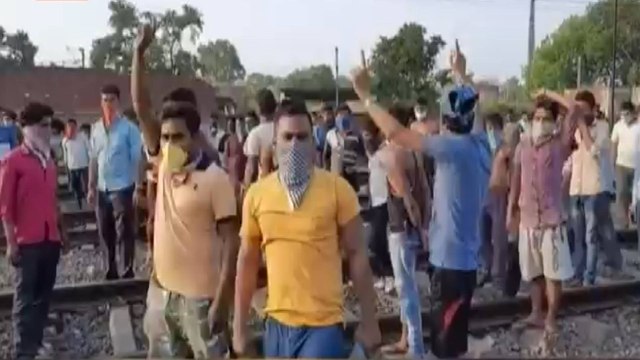 Migrants protest at station over change in routes of train