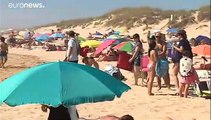 Crowds flock to Portugal's beaches as government eases coronavirus restrictions