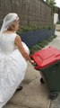 Woman Wearing Wedding Dress Drags Trash bin Outside House on her Anniversary During Quarantine