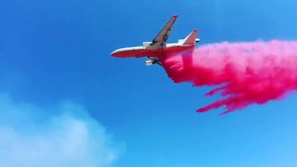 Air tanker drops retardant over Arizona fire