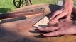 Man Uses Pedal Powered saw to cut Wood Logs Into Jigsaw Puzzle Pieces