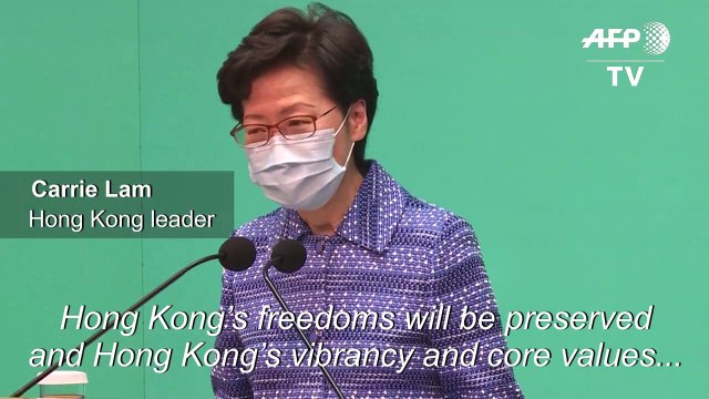 Hong Kong leader tries to reassure investors rattled by China law