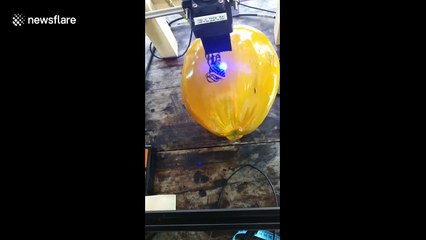 Vietnamese shop uses lasers to decorate coconut shells