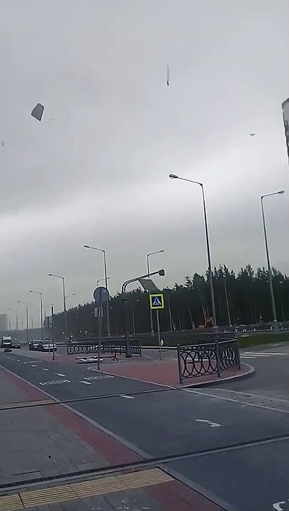 Building Materials Fly Off a Building During a Storm