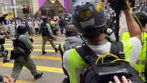 Hong Kong police shoot pepper spray projectiles at protesters