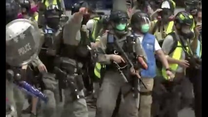 Hong Kong police fire pellets to disperse protests