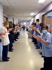 Nurse Becky Usher is applauded as she leaves Pinderfields Hospital