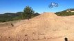 Biker Bails Mid-Jump and Comes Sliding Down Dirt Ramp