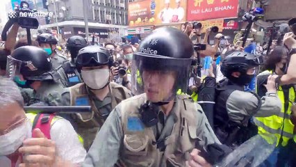 Download Video: Hong Kong police brutally throw young journalist to the ground before pepper-spraying him