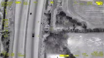 This dramatic police helicopter footage shows the moment cops arrested a gang of bungling burglars - after they tried to hide up a TREE-