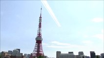 Japanese air force jets fly over the city of Tokyo