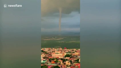 Incredible triple waterspout tornado seen over bay in the Philippines