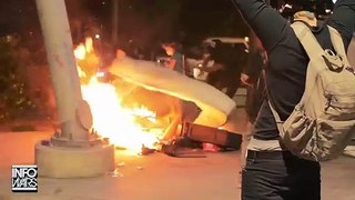 Rioters burn a homeless person's belongings.   Reportedly from Austin, Texas.