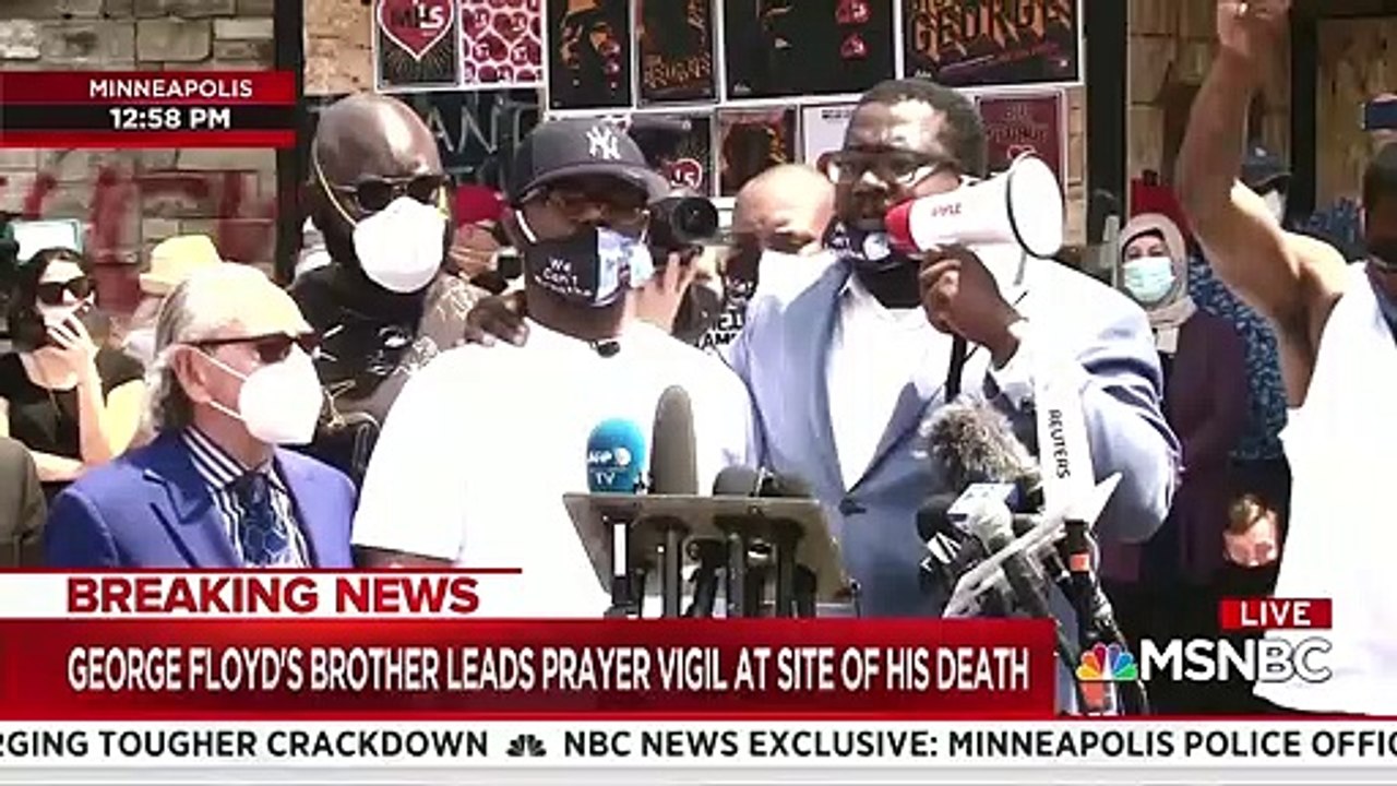 Terrence Floyd leads protest crowd in prayer at the site of his brother's death