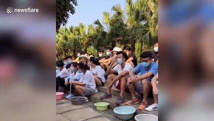 University students in China use bowls of water to learn how to swim during coronavirus pandemic