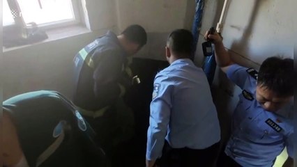 Chinese firefighters rescue infant trapped in rubbish chute in residential building