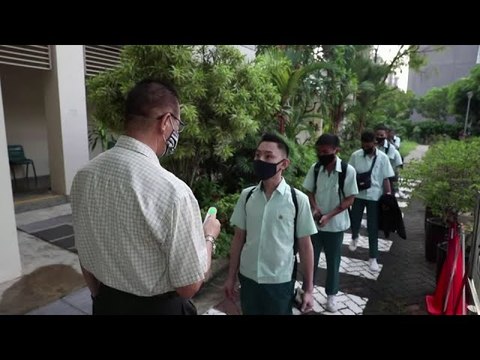 Schools reopen as Singapore eases lockdown restrictions