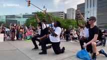 Detroit protesters take a knee for George Floyd in emotional rally