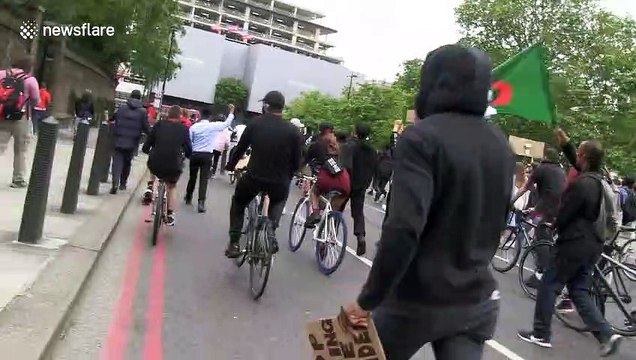 Black Lives Matter protesters throw water bottles at police during London march