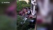 Chinese neighbour climbs two floors barehanded to rescue toddler trapped outside balcony