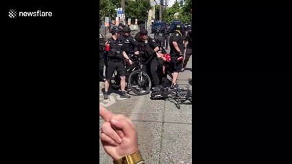 'Get off her!' Seattle police takedown protester at peaceful rally