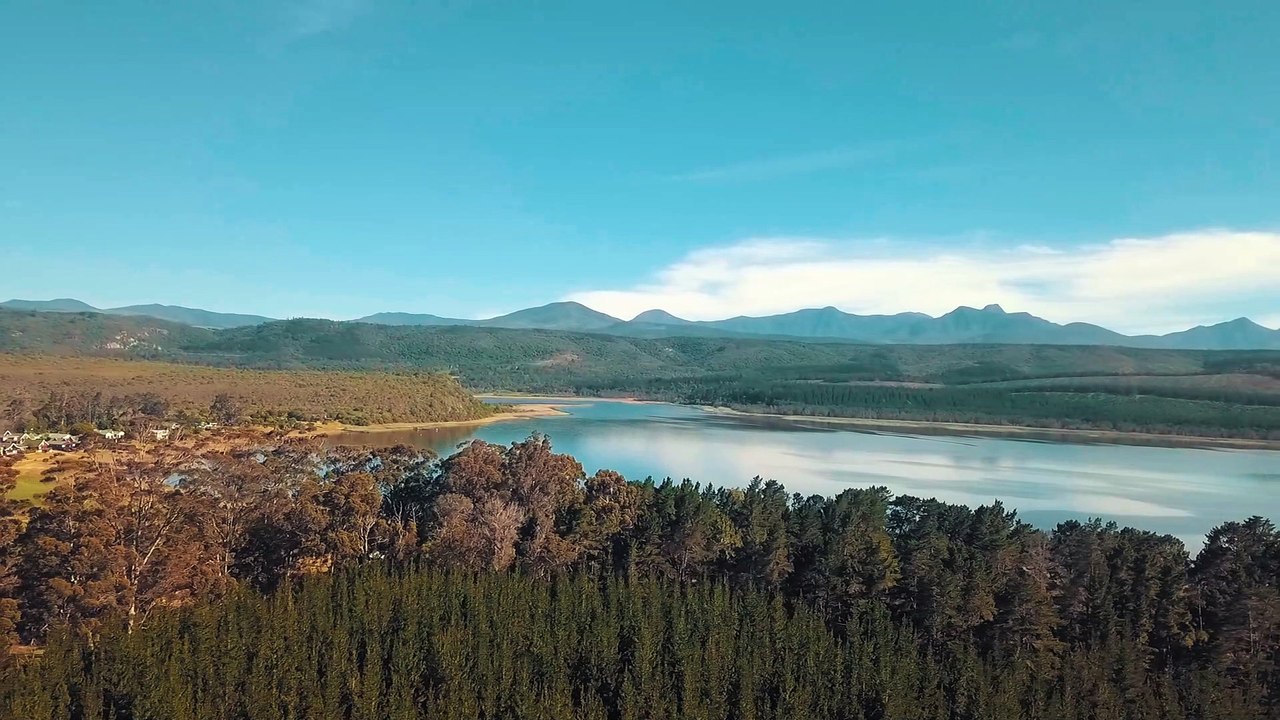 Natural Landscapes Of Mountain Ranges Surrounding A Lake