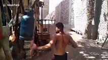 Egyptian boxers extreme training routine involves punching metal gas tanks