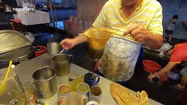 Watch this market stall make traditional Malaysian style coffee
