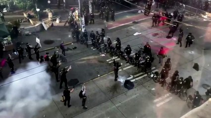 Seattle police use flash bangs to move protesters on street