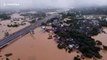 Dozens of vehicles park on bridge to avoid flash floods after southern Chinese city is submerged