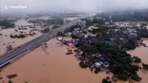 Dozens of vehicles park on bridge to avoid flash floods after southern Chinese city is submerged