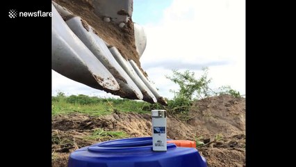 Incredible skills of digger driver who uses excavator arm to light a lighter