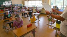 Face shields on, Japanese students go back to school