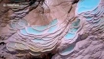 Drone footage showcases magnificent travertine terraces in southwestern China