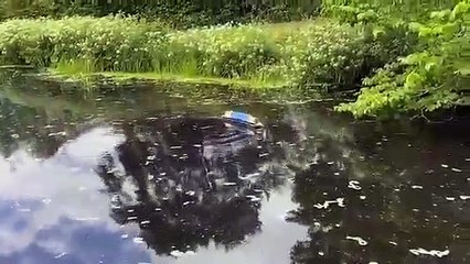 Colin Ogden sails a boat up Tewitfield Locks for the first time since 1968