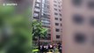 Chinese firefighters rescue girl hanging from 13th-floor window