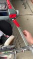 Guy Carries Friend in Shopping Cart out of Store and Locks him With Other Carts