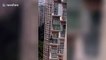 Chinese children captured playing on angled roof of high-rise building