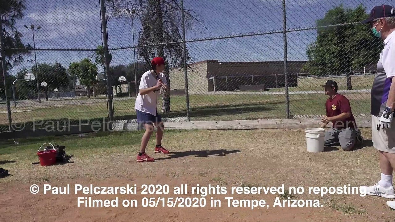 Thor working on his swing hitting into fence