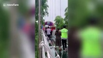 'The bridge is going to collapse': Security guard shouts at a group of women dancing on glass bridge in China