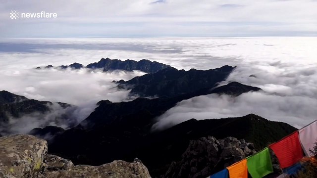 Stunning timelapse showcases sea of clouds flowing through mountains in northern China
