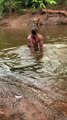 Man Catches Enormous Fish with his Bare Hands
