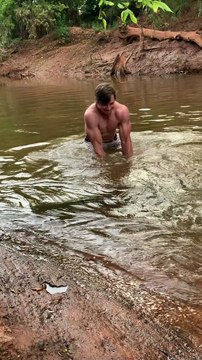Man Catches Enormous Fish with his Bare Hands