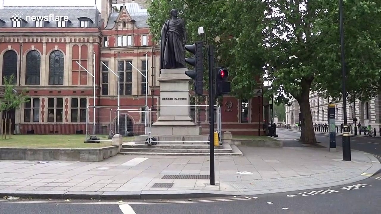 George Canning statue in scaffolding and Winston Churchill monument boarded up ahead of BLM protests in central London